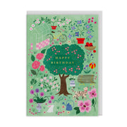 Mint green card illustrated with a cottage garden scene and a central tree