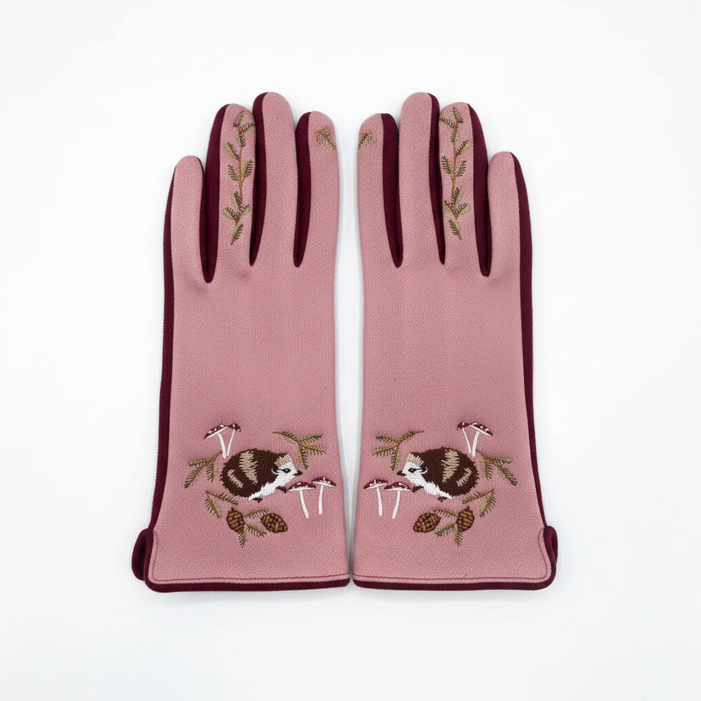 Pair of Secret Garden Hedgehog gloves laid flat, showcasing intricate embroidery and soft detailing.