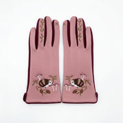 Pair of Secret Garden Hedgehog gloves laid flat, showcasing intricate embroidery and soft detailing.