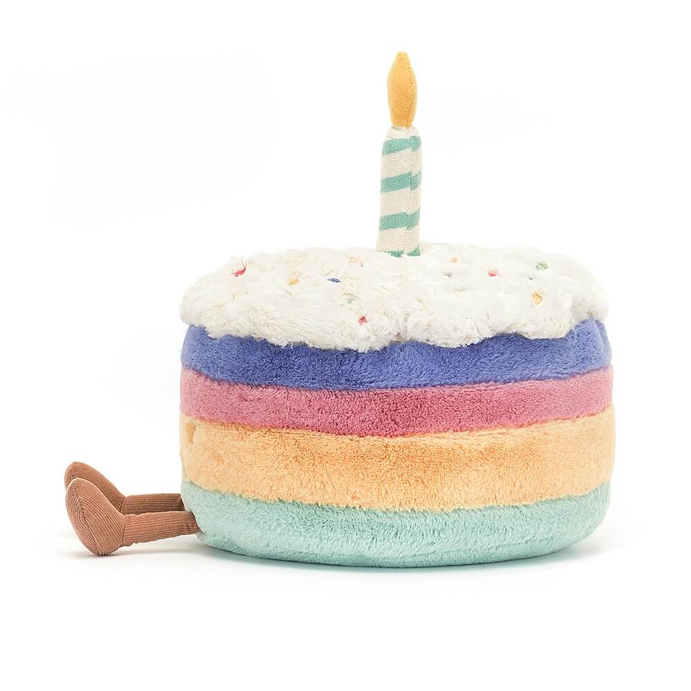 Dive into the details of the Amuseable Rainbow Birthday Cake! Each layer boasts a different vibrant color, topped with fluffy icing and a fun suedette candle. A cuddly gift for all ages!