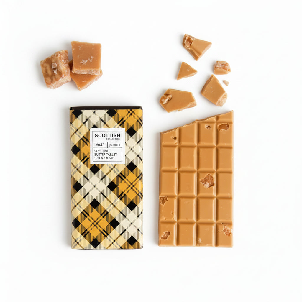 Handmade Scottish Tablet Chocolate Bar with creamy gold and white chocolate, studded with authentic butter tablet pieces and wrapped in a yellow tartan design.