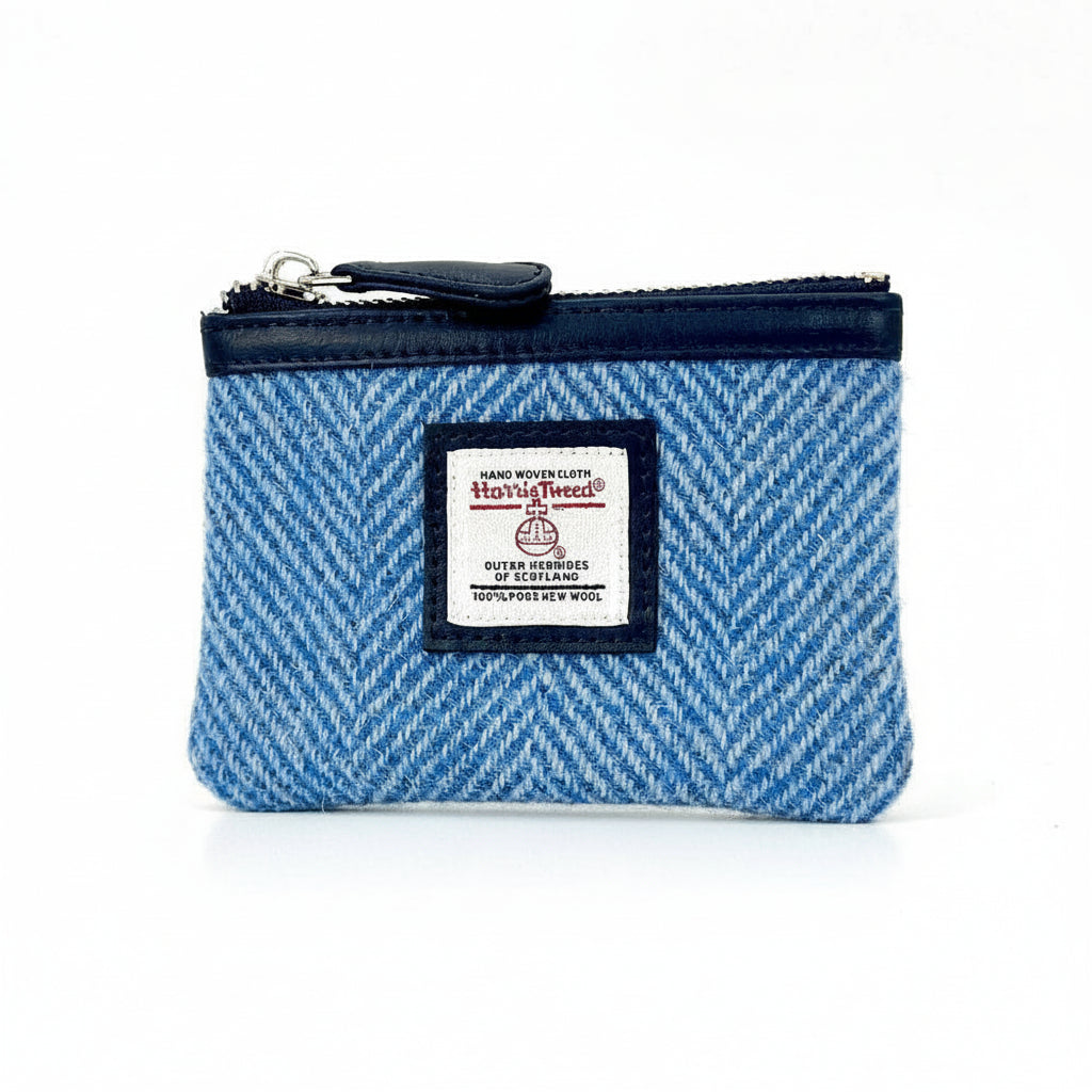 Angled front shot of Harris Tweed sky blue herringbone coin purse.