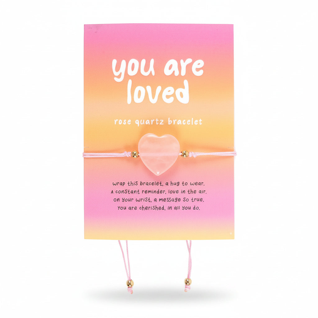 Elasticated rose quartz heart bracelet on card with “You Are Loved” message, ideal self-love or friendship gift.