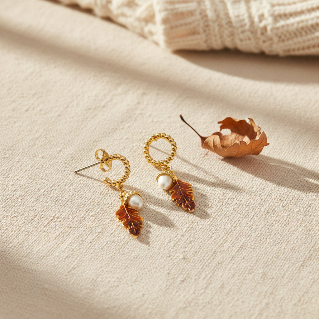 Bill Skinner Acorn and Oak Drop Earrings with enamel oak leaves and acorns, on white
