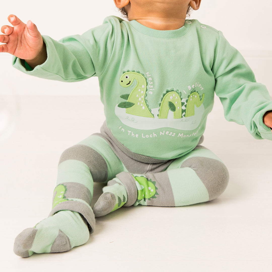 Baby wearing the Nessie socks with the matching green top and leggings