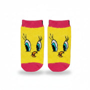Tweety Bird socks laid flat showing character face on pink background
