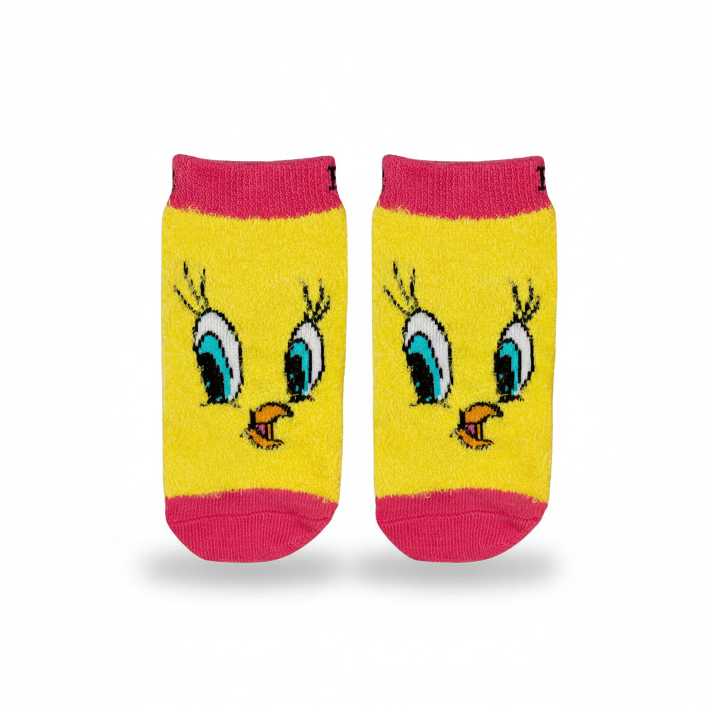 Tweety Bird socks laid flat showing character face on pink background