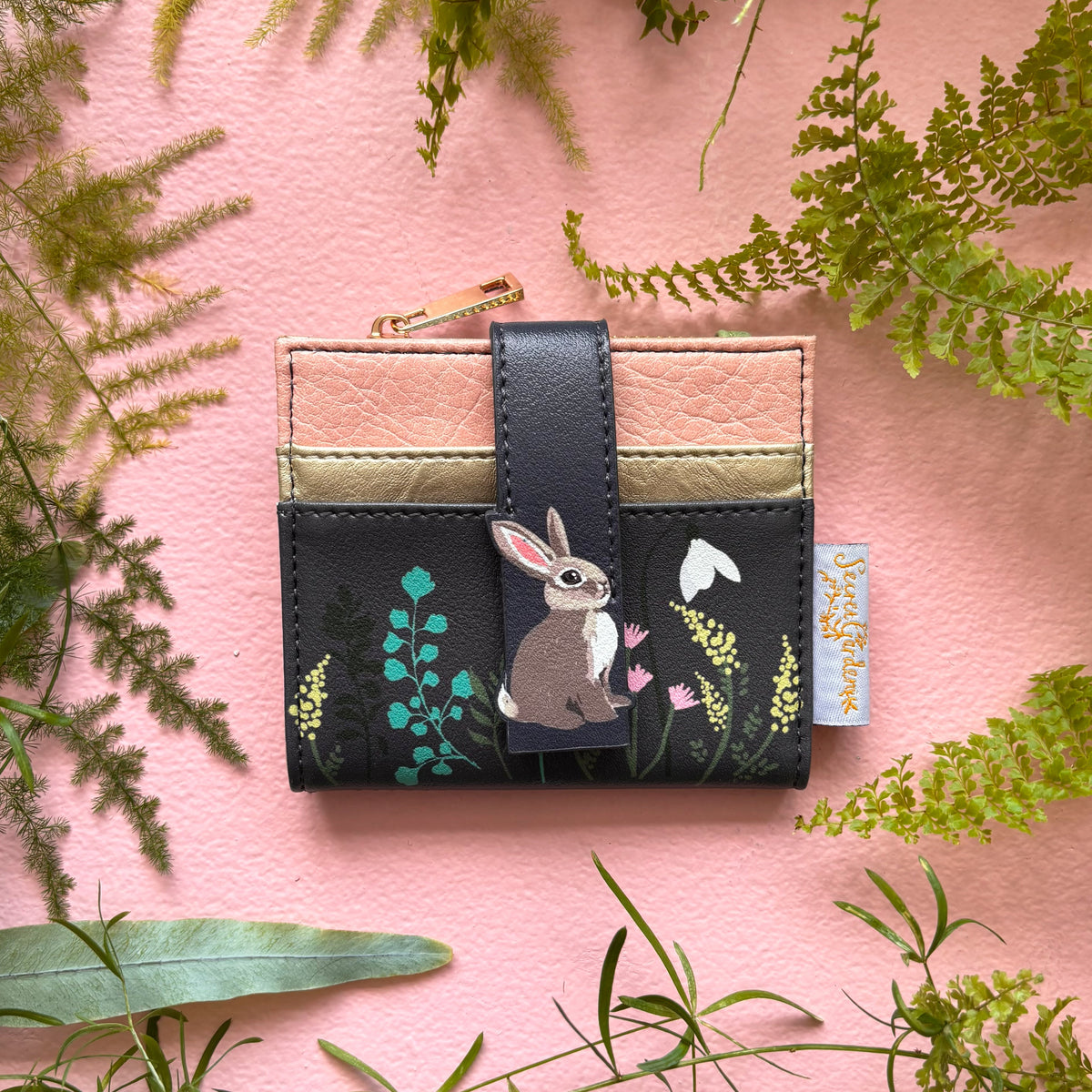 Secret Garden rabbit foldover purse front view on pink background
