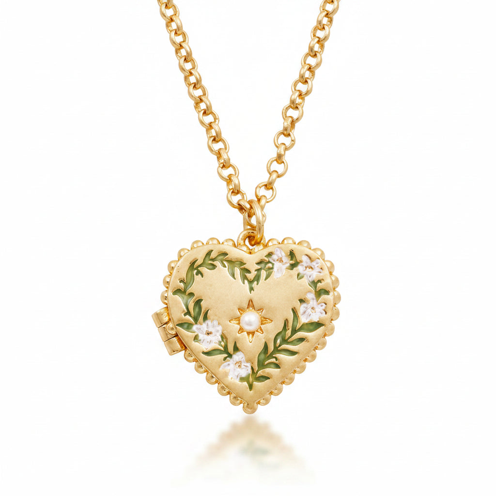 Close-up of Jasmine Heart Locket Necklace with hand-painted enamel lilies and faux pearl detail.