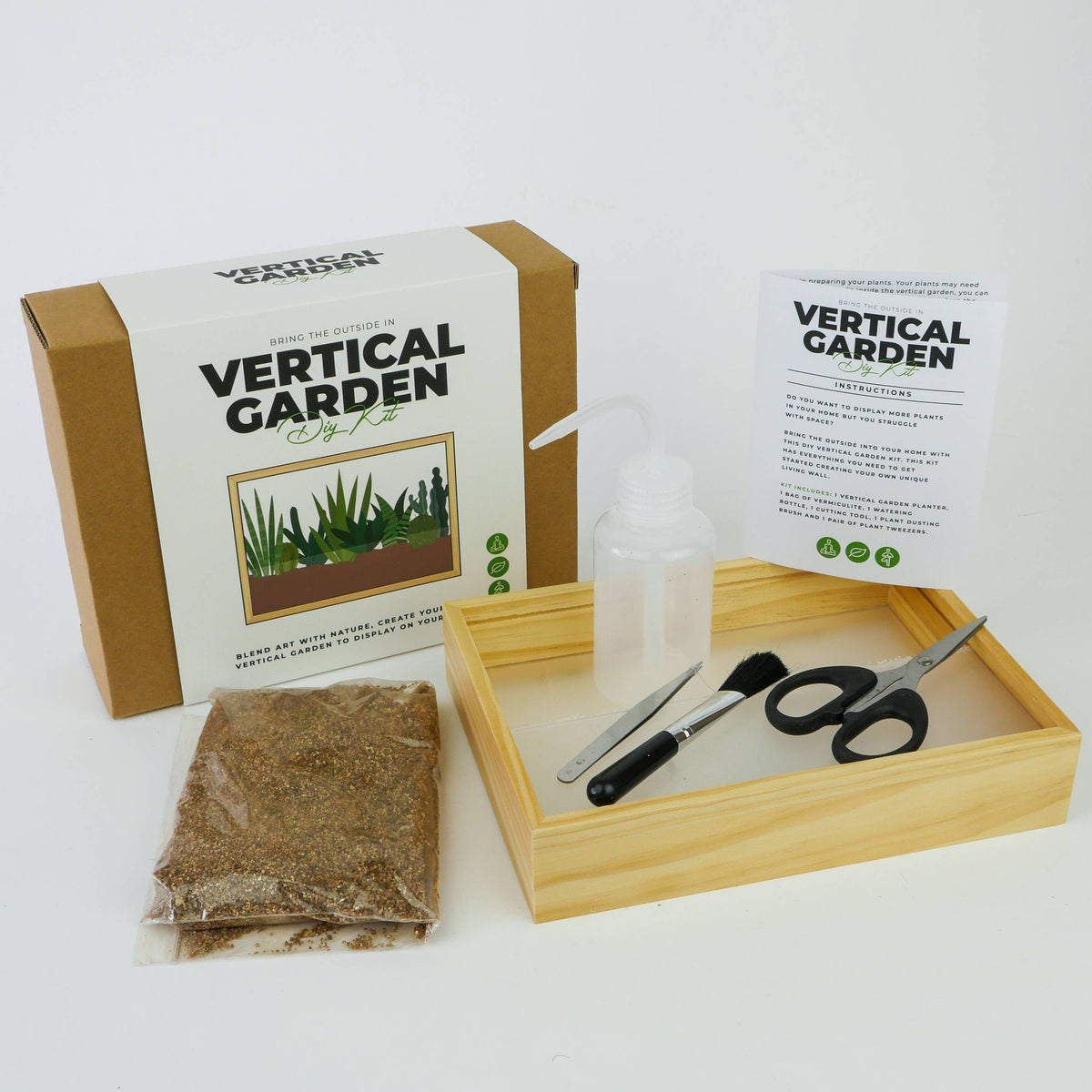 Vertical Garden kit contents with tools and vermiculite on white background