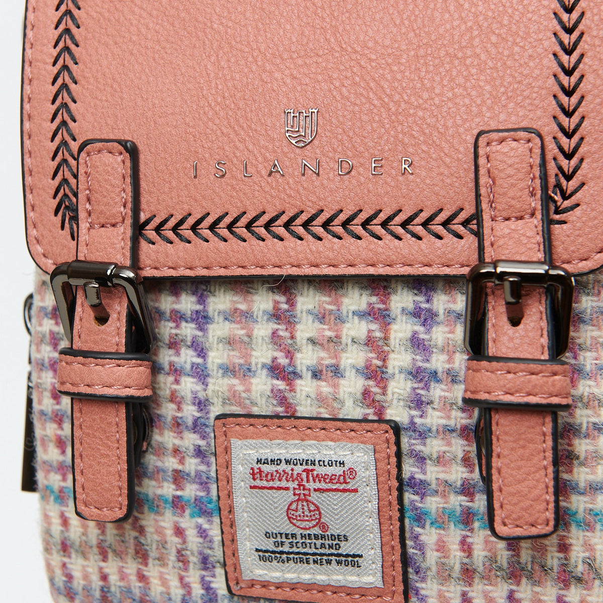 Harris Tweed orb label on the pink and purple mini dogtooth Baby Jura crossbody