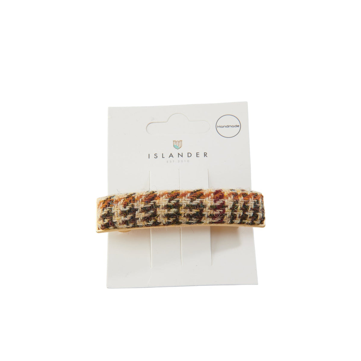 Harris Tweed beige dogtooth hair clip on Islander branded packaging card