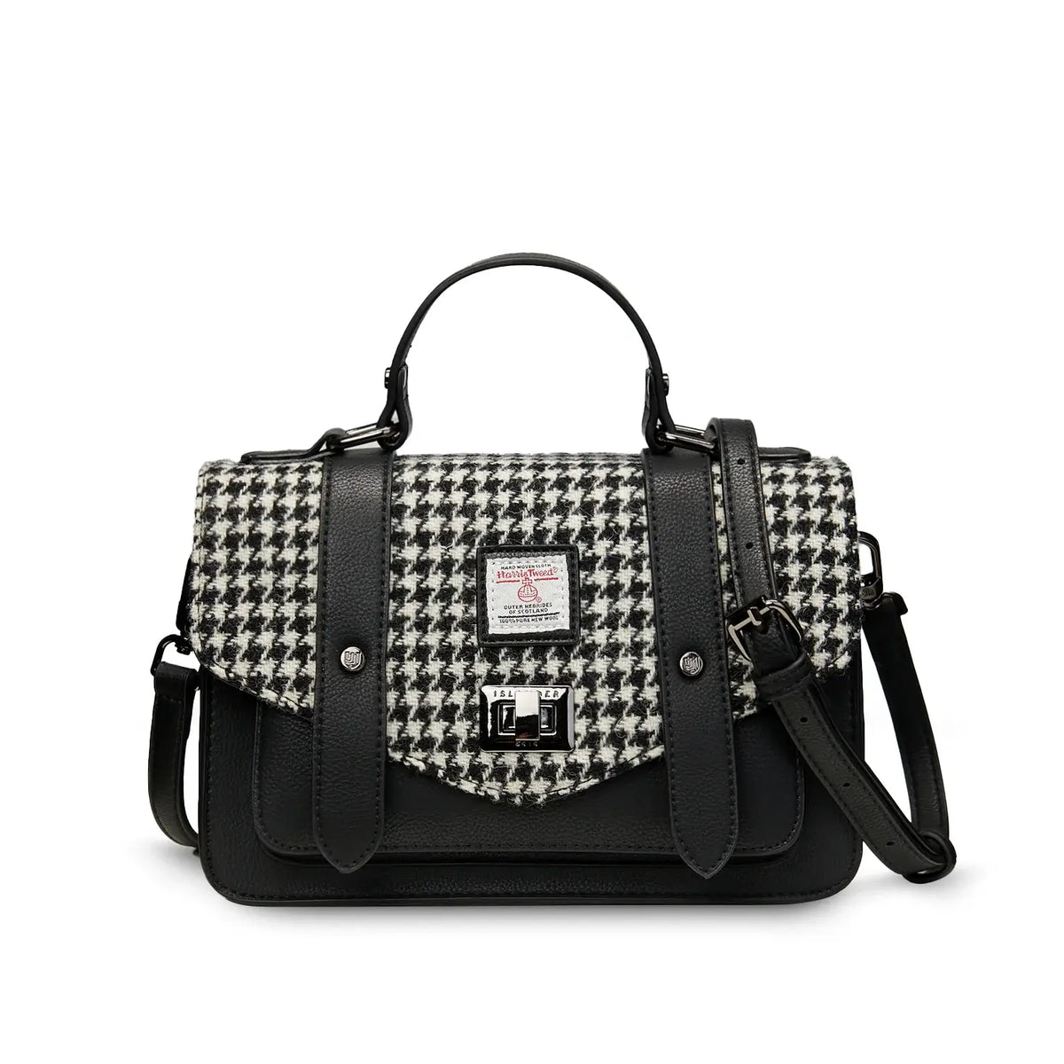 Black and white dogtooth Harris Tweed satchel with black handle on white background