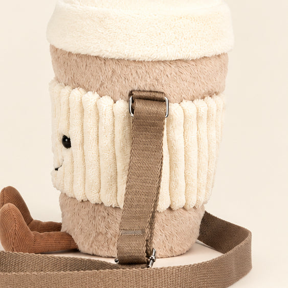 Side view of the Jellycat Perkle Coffee Shoulder Bag showing its fluffy cream lid and taupe sleeve