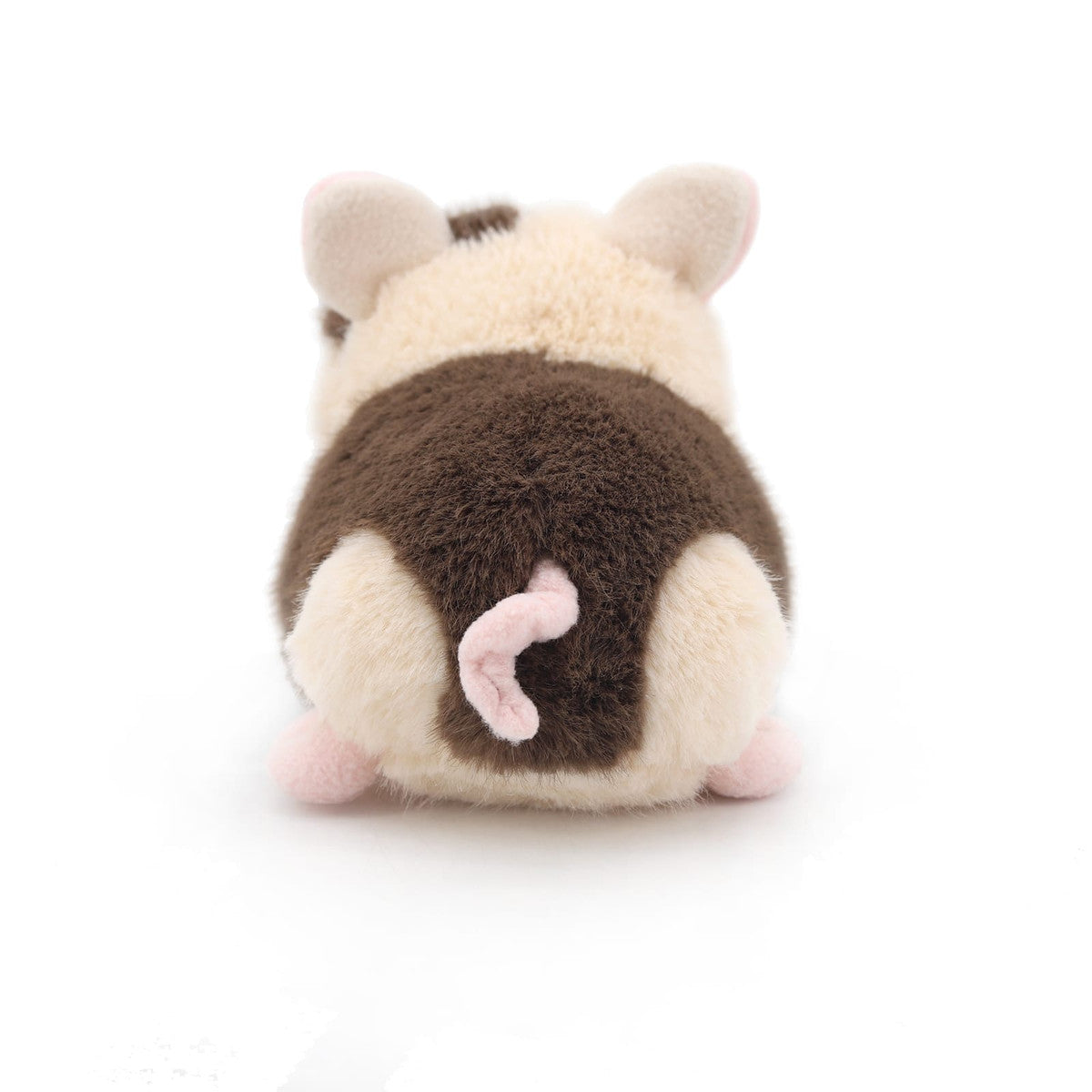 Spotty pig soft toy back view showing curly pink tail on white background