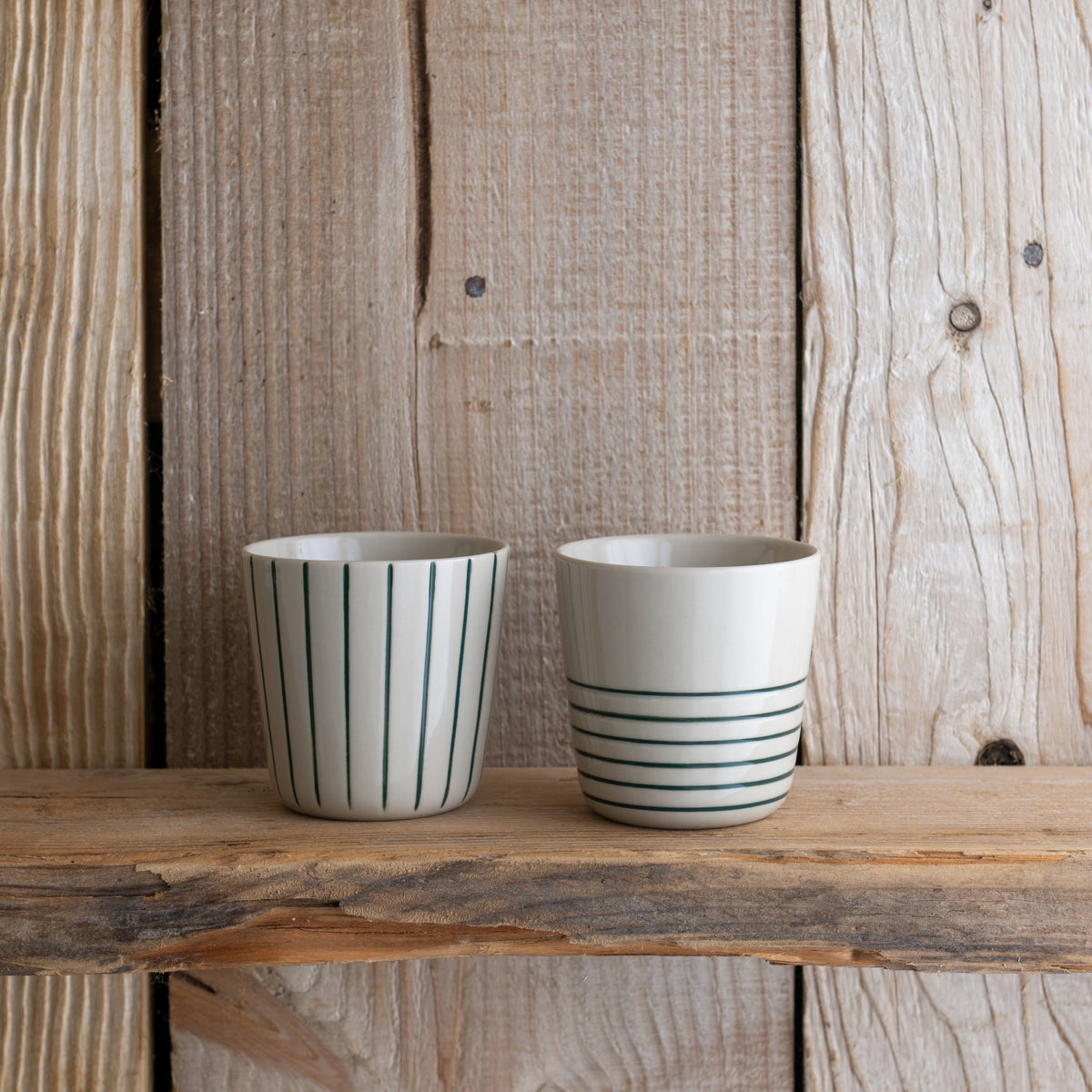 Small sea green Sorrel beakers on a rustic wooden shelf