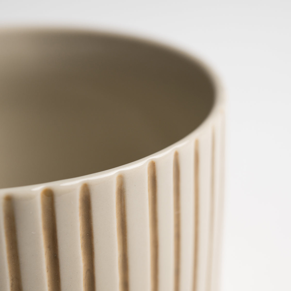 Close up of the hand-etched mustard linework on a Yarrow mug