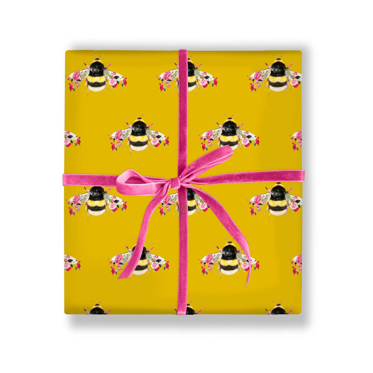 Gift wrapped in botanical bee paper with ribbon