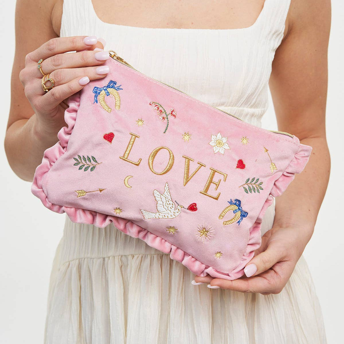 Pouch held by model
