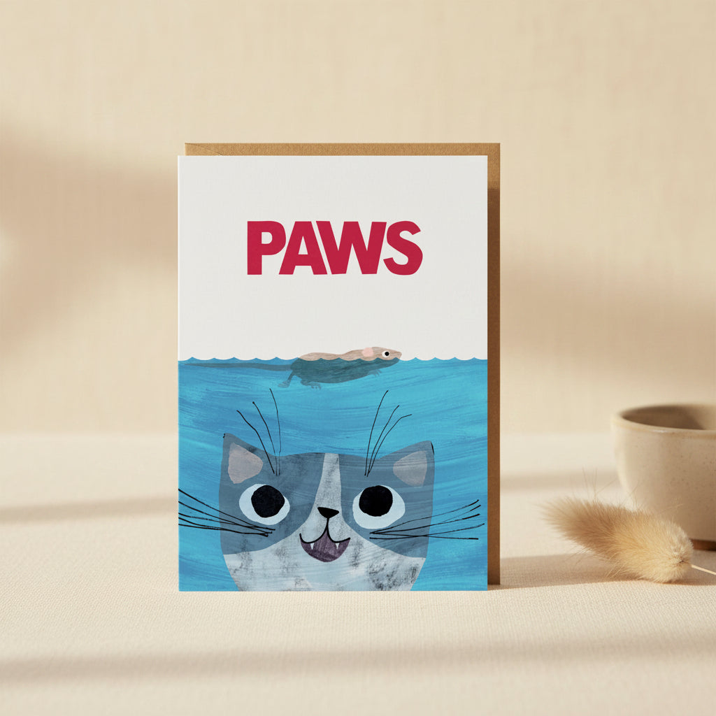 Card with a cat peeking out of water and the word 'PAWS' above it.