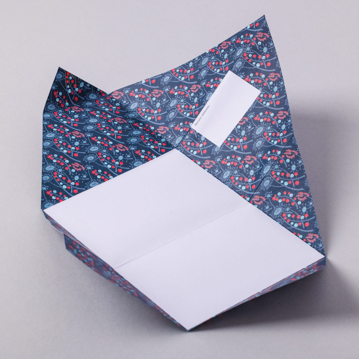 Unfolded Hedgerow Pigeon with botanical berry and flower interior on grey background