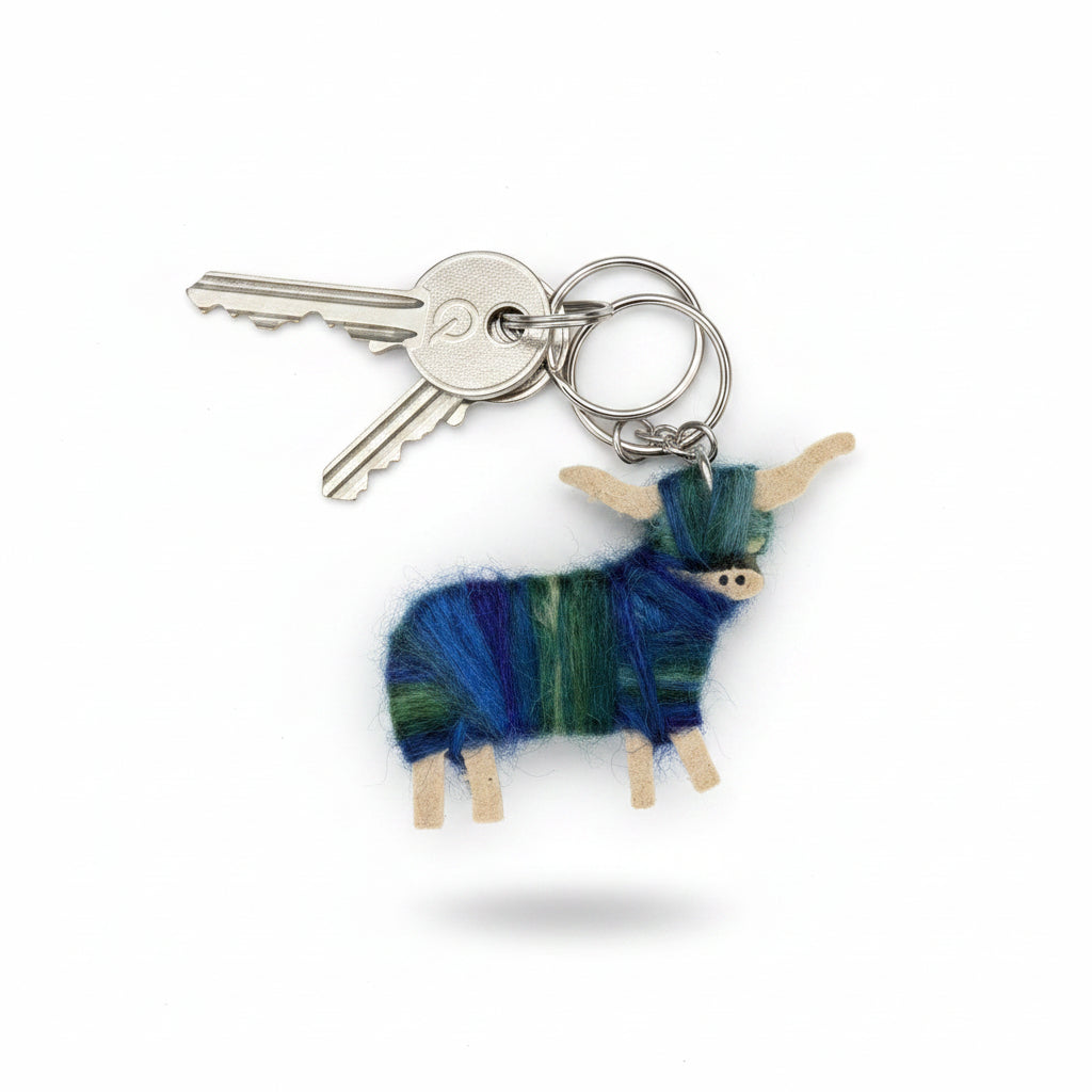Blue Highland cow keyring, a small wooden coo hand-wrapped in blue-dyed mohair with a stainless steel key ring