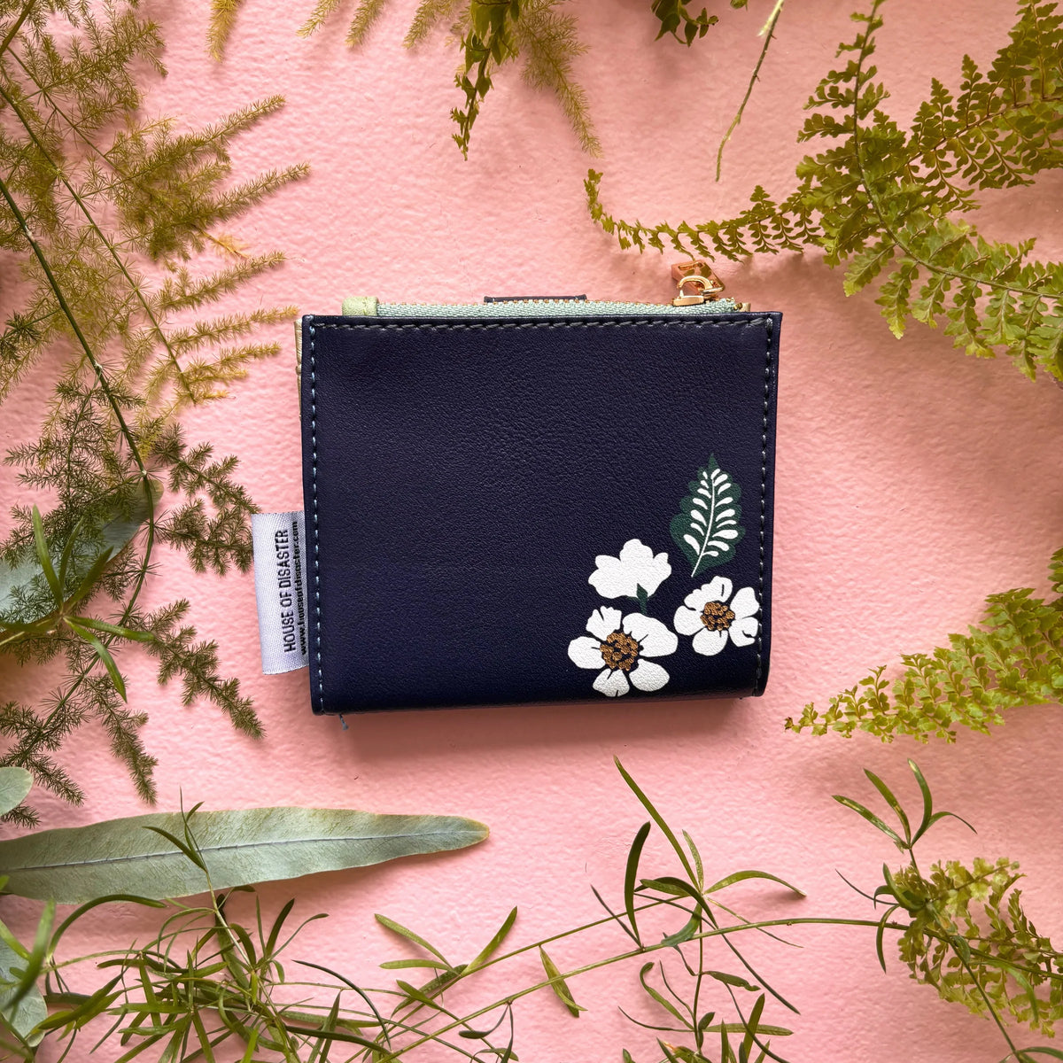 Back view of bird purse with floral illustration