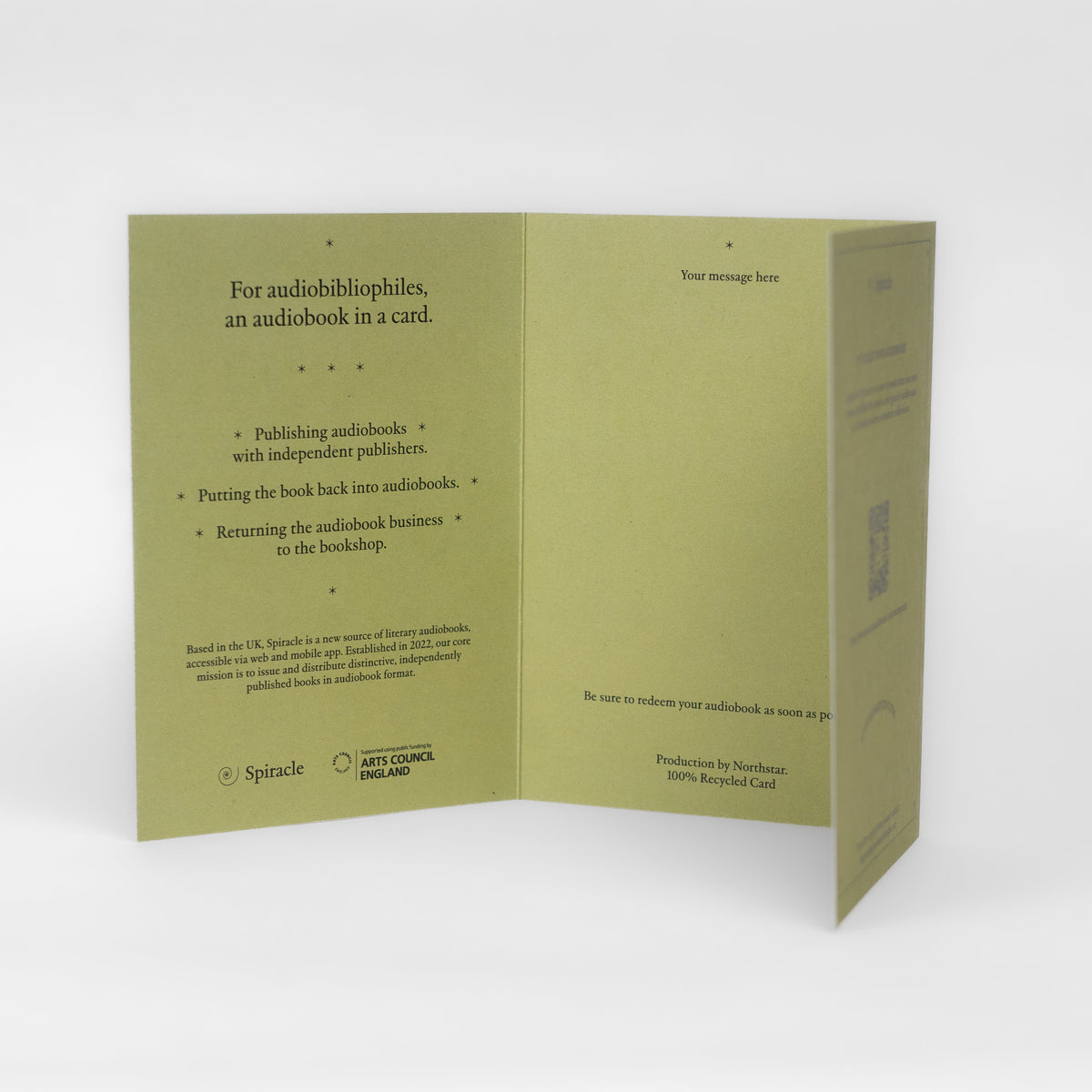 Spiracle audiobook card styled on a table with its kraft envelope