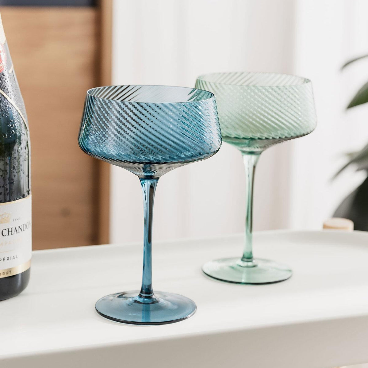 Twist champagne coupes in a styled setting
