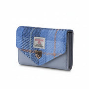 Side angle of the Harris Tweed Blue Tartan clasp purse. The purse has a soft blue PU leather body and finished with the Islander logo on the front.